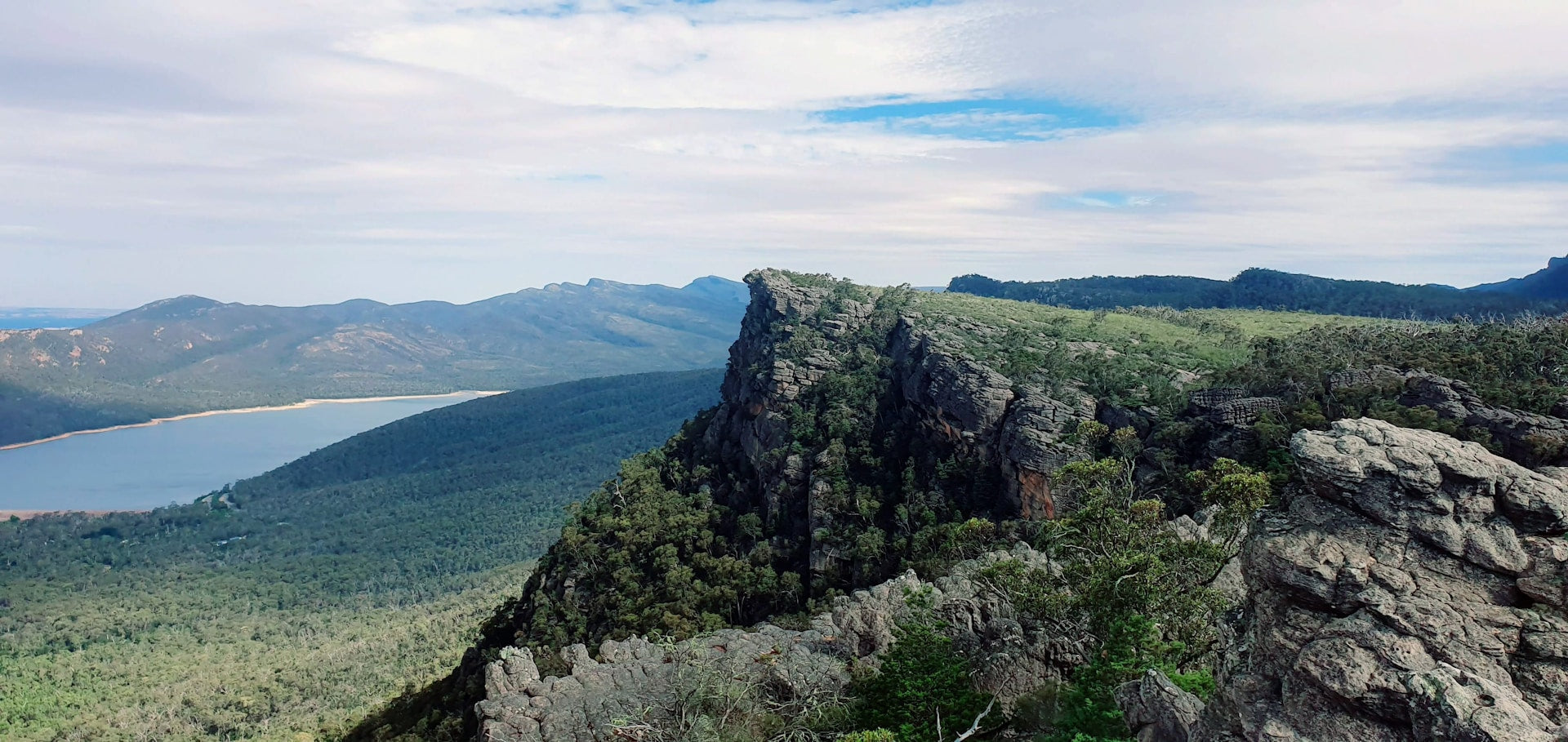 A beautiful view from the top of a mountain overlooking a lake